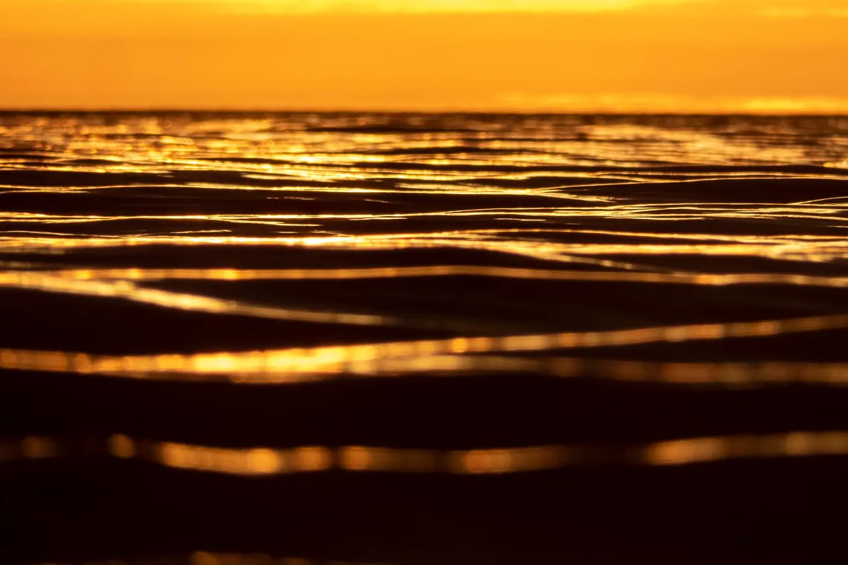 Amanecer reflejando en el mar por Darío Sander