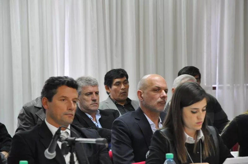 Buzzi, Segundo y Eliceche juntos en la audiencia.
